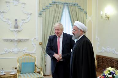 Iran's President Hassan Rouhani and Boris Johnson meeting in December 2017. FILE