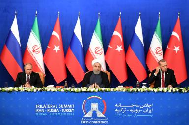 حسن روحانی، رییس جمهوری ایران، به‌همراه ولادیمیر پوتین و رجب‌طیب اردوغان، همتایان روس و ترک خود در نشست تهران