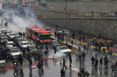 Protesters block roads in Tehran before security forces crack down, killing hundreds. November 15, 2019