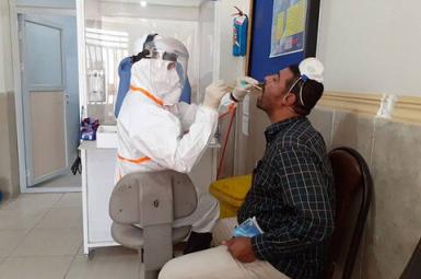 A man being tested for Coronavirus infection in Tehran. File