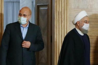 Iran's parliament speaker Ghalibaf (L) and president Hassan Rouhani. FILE