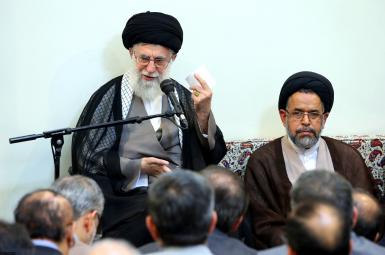 Iran's Intelligence Minister Alavi sitting next to Supreme Leader Khamenei. FILE