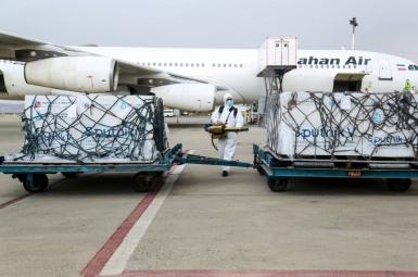 An Iranian airliner unloading Covid vaccines. 