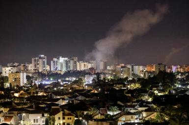 Smoke rises over houses in Ashkelon following a rocket attack launched from Gaza towards Ashkelon, southern Israel, May 14, 2021.
