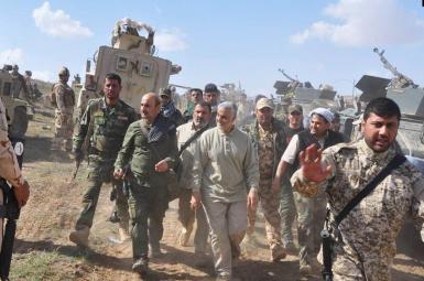 An undated photo showing Qasem Soleimani with proxy forces in Iraq.