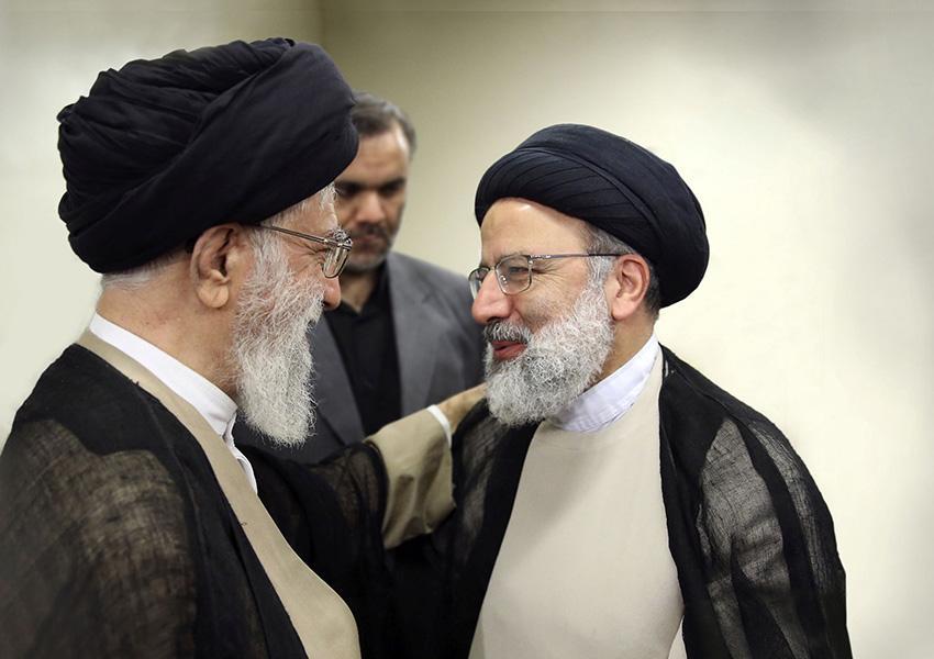 Hardliner Judiciary chief Ebrahim Raeesi (R) with Supreme Leader Ali Khamenei. FILE PHOTO