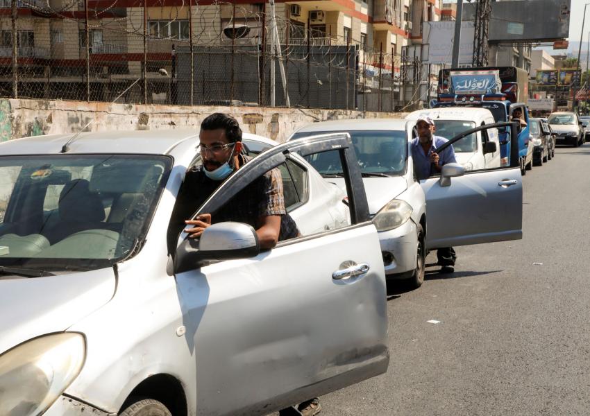 Lebanese pushing their cars near a gas station in Beirut amid fuel shortages. August 17, 2021