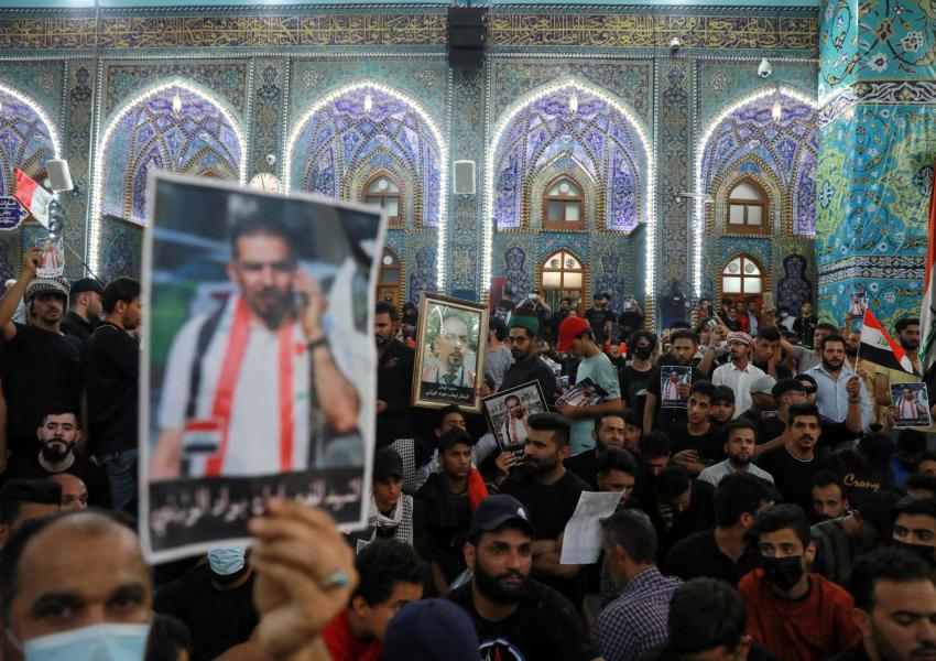Mourners attend a funeral of Iraqi civil society activist Ehab al-Wazni, who was killed by unidentified gunmen, in Kerbala, Iraq, May 9, 2021.